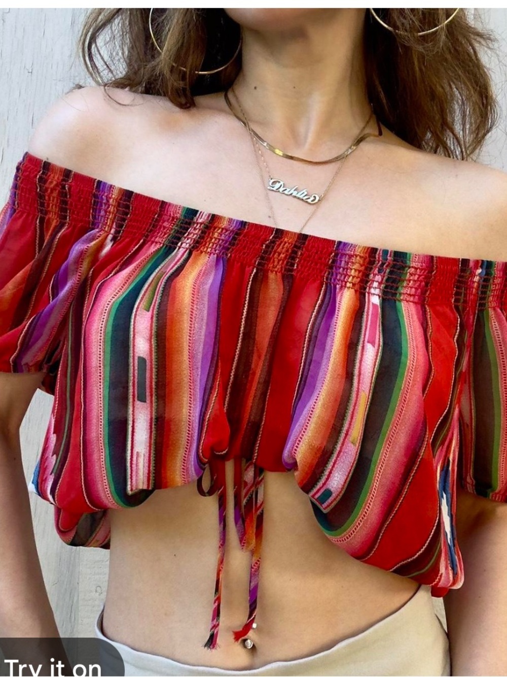 multicolor striped Wet Seal crop top with off-the-shoulder styling.